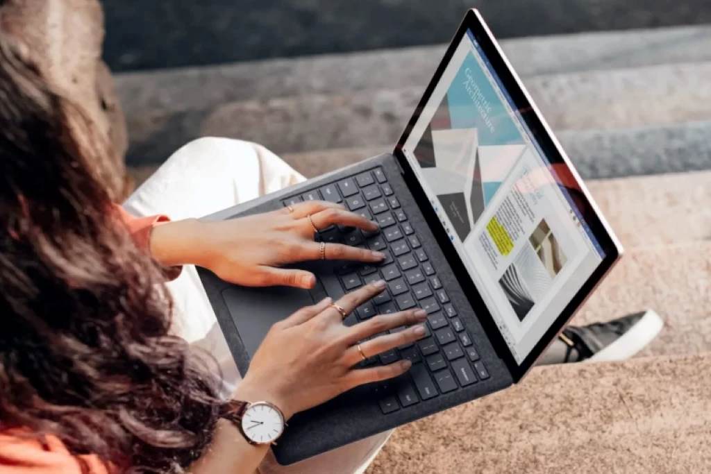 Customer watching product demo video on laptop